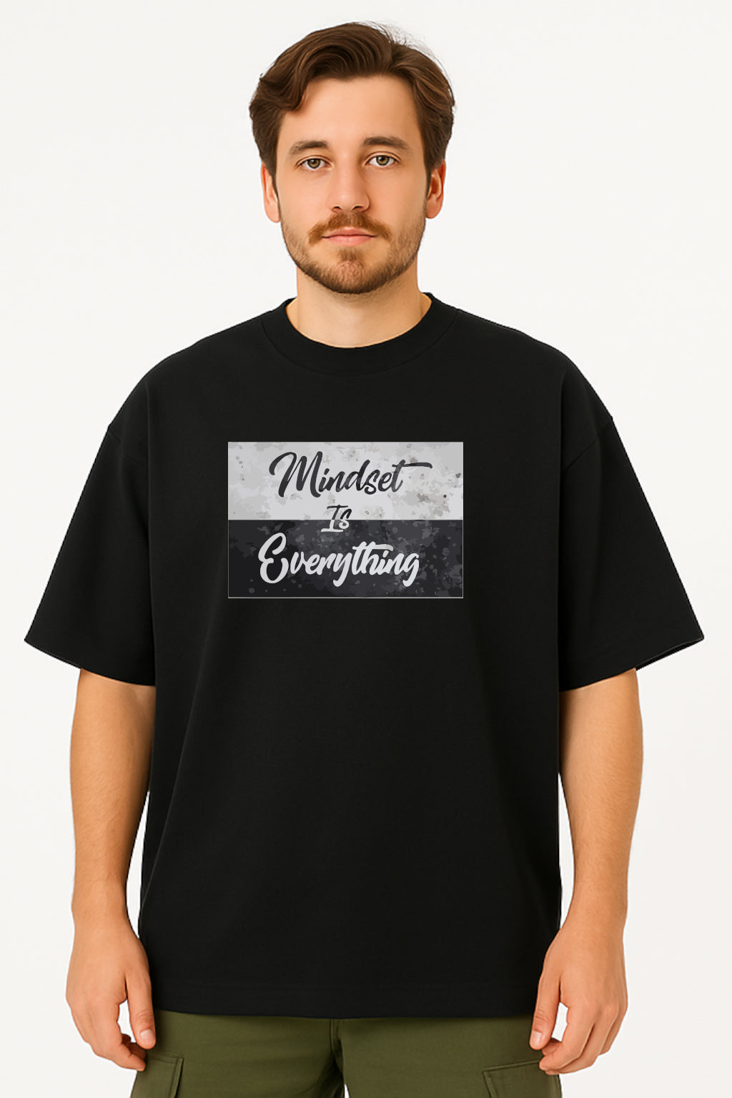 Man wearing a black t-shirt with 'Mindset is Everything' text on a white background