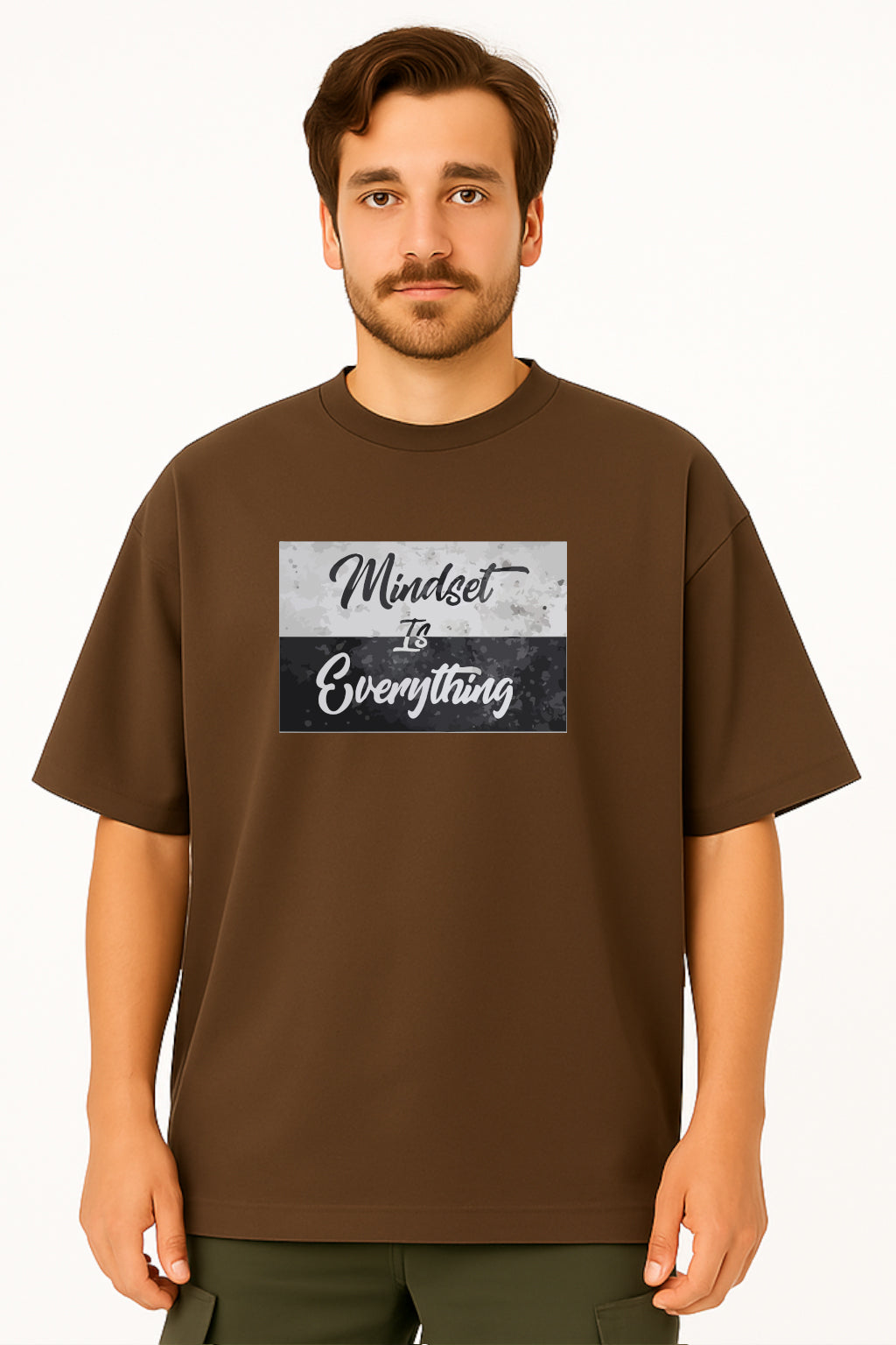 Man wearing a brown t-shirt with 'Mindset is Everything' text design on a white background