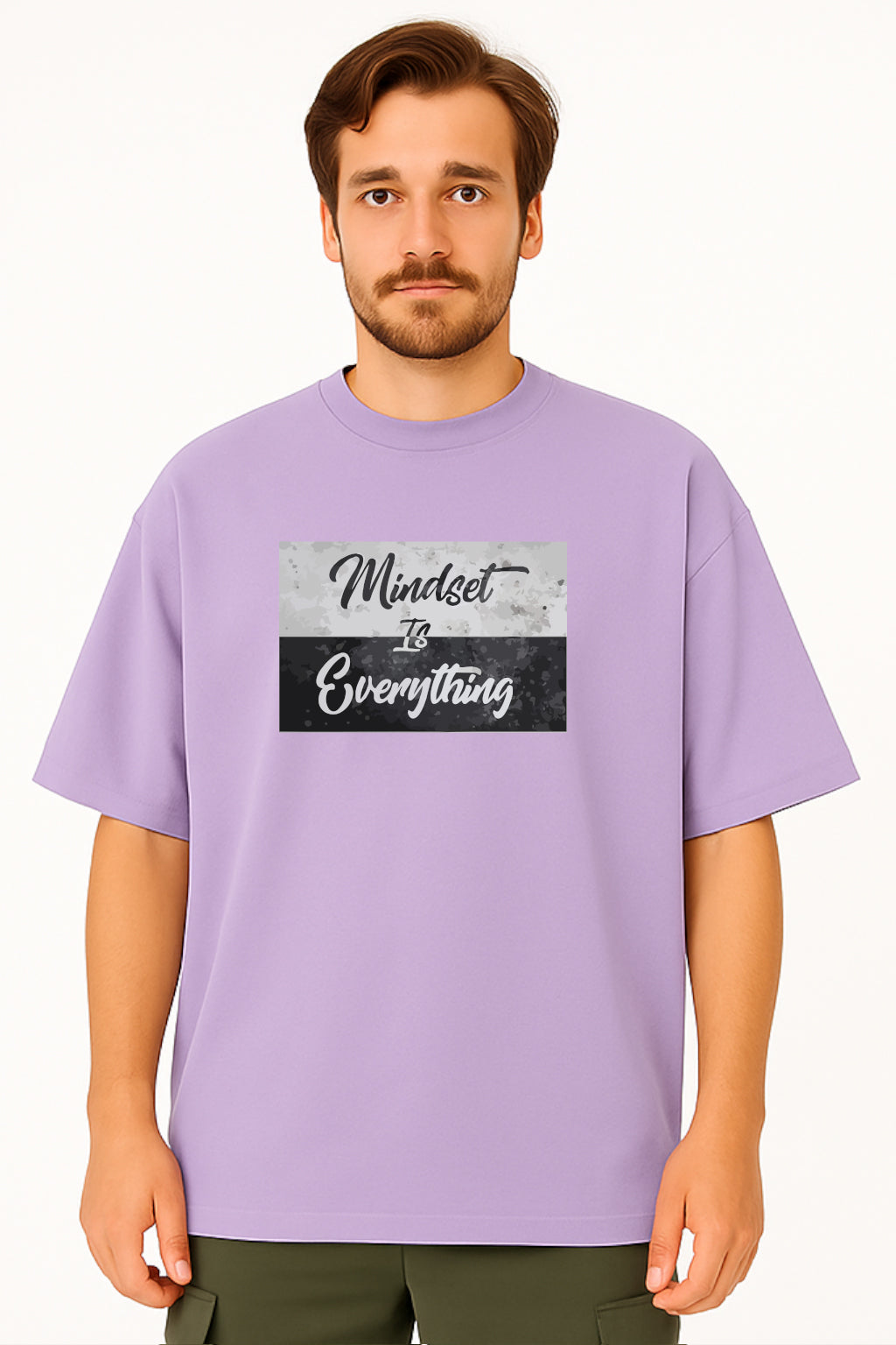 Man wearing a purple t-shirt with 'Mindset is Everything' text design on a white background