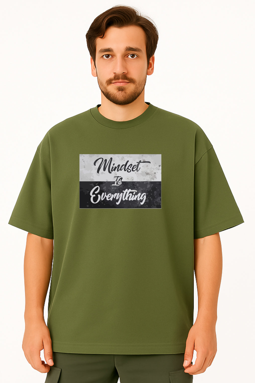 Man wearing a green t-shirt with 'Mindset is Everything' text design on a white background