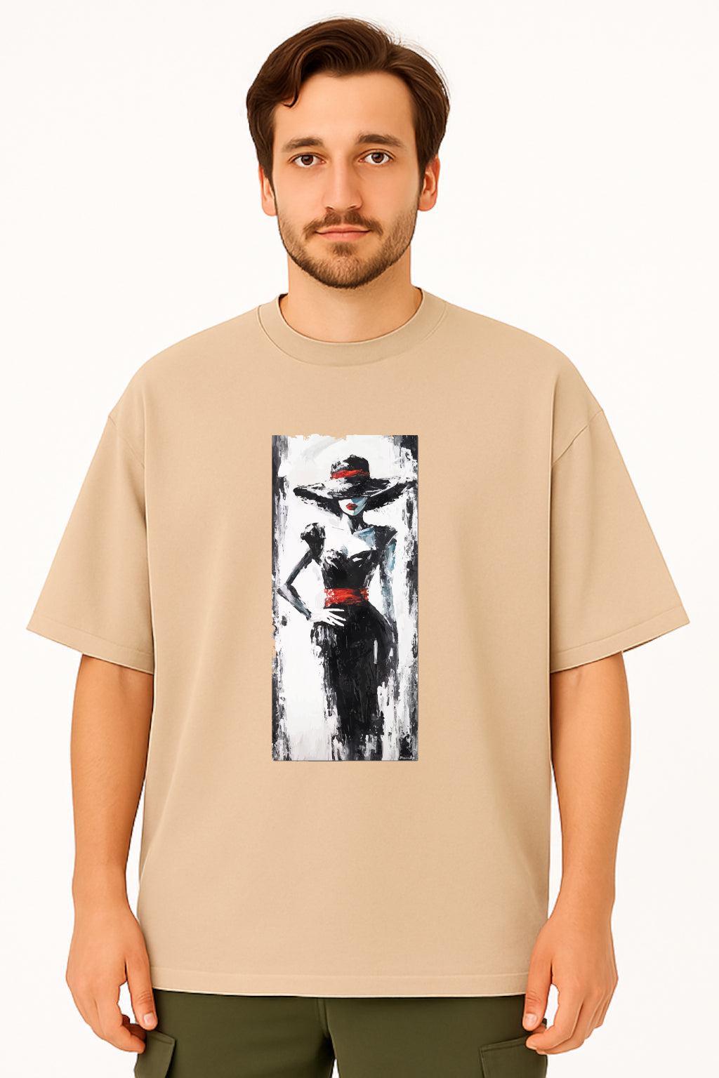Man wearing a beige t-shirt with a graphic design of a woman in a hat and dress.