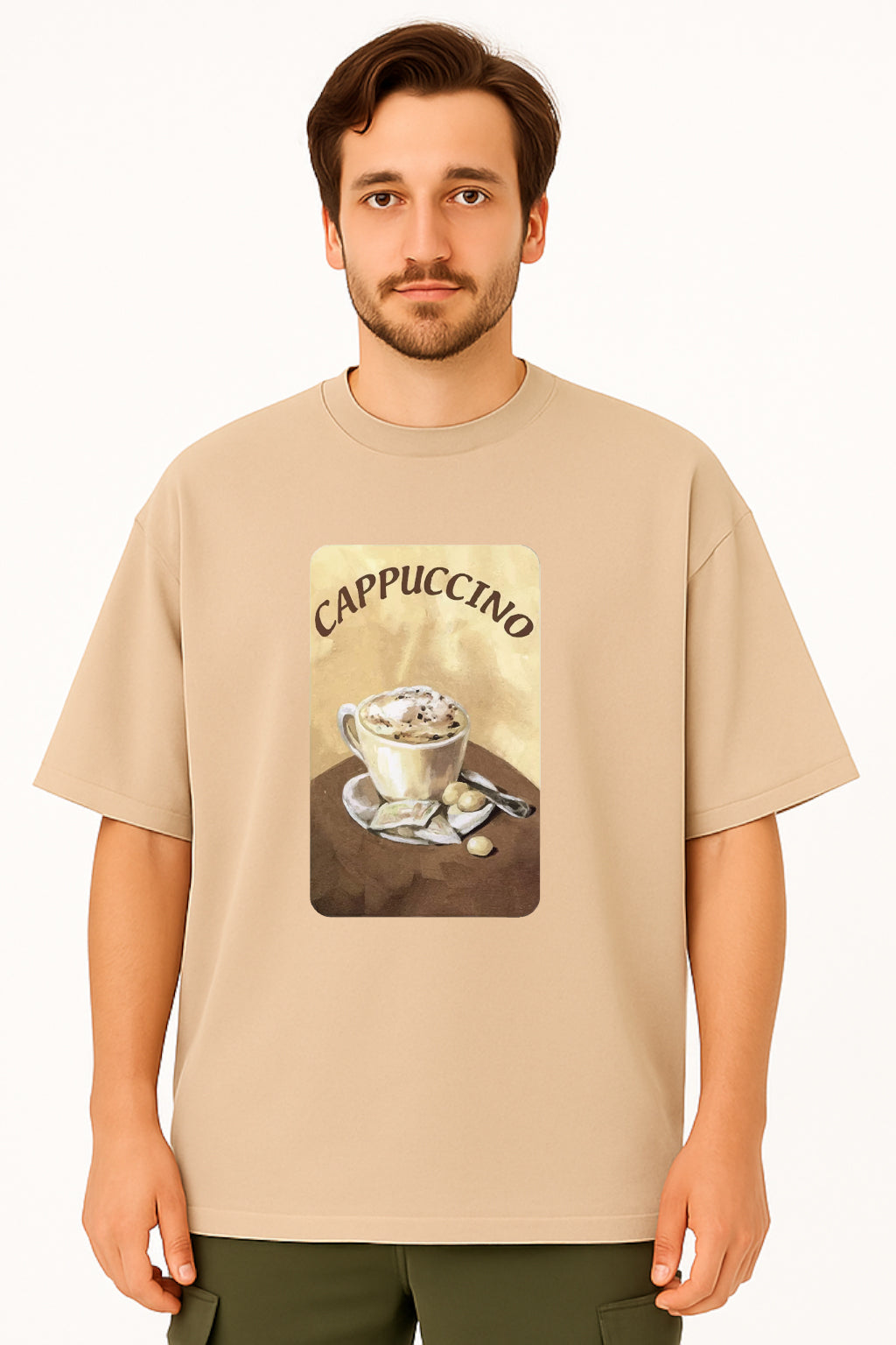 Man wearing a beige t-shirt with a cappuccino graphic design on a white background