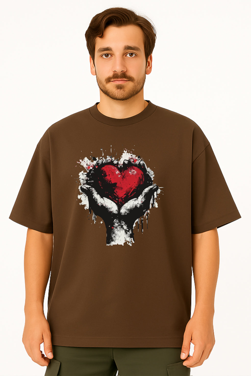 Man wearing a brown t-shirt with a graphic design of a heart and hands on a white background