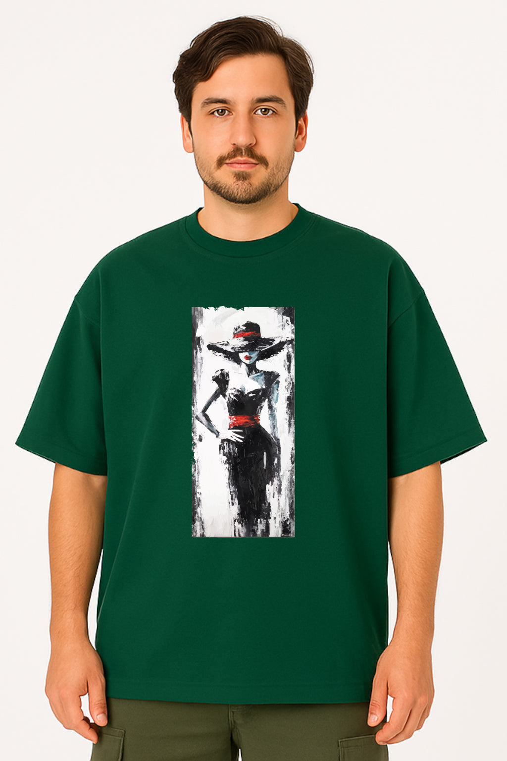 Man wearing a green t-shirt with a graphic design on a white background