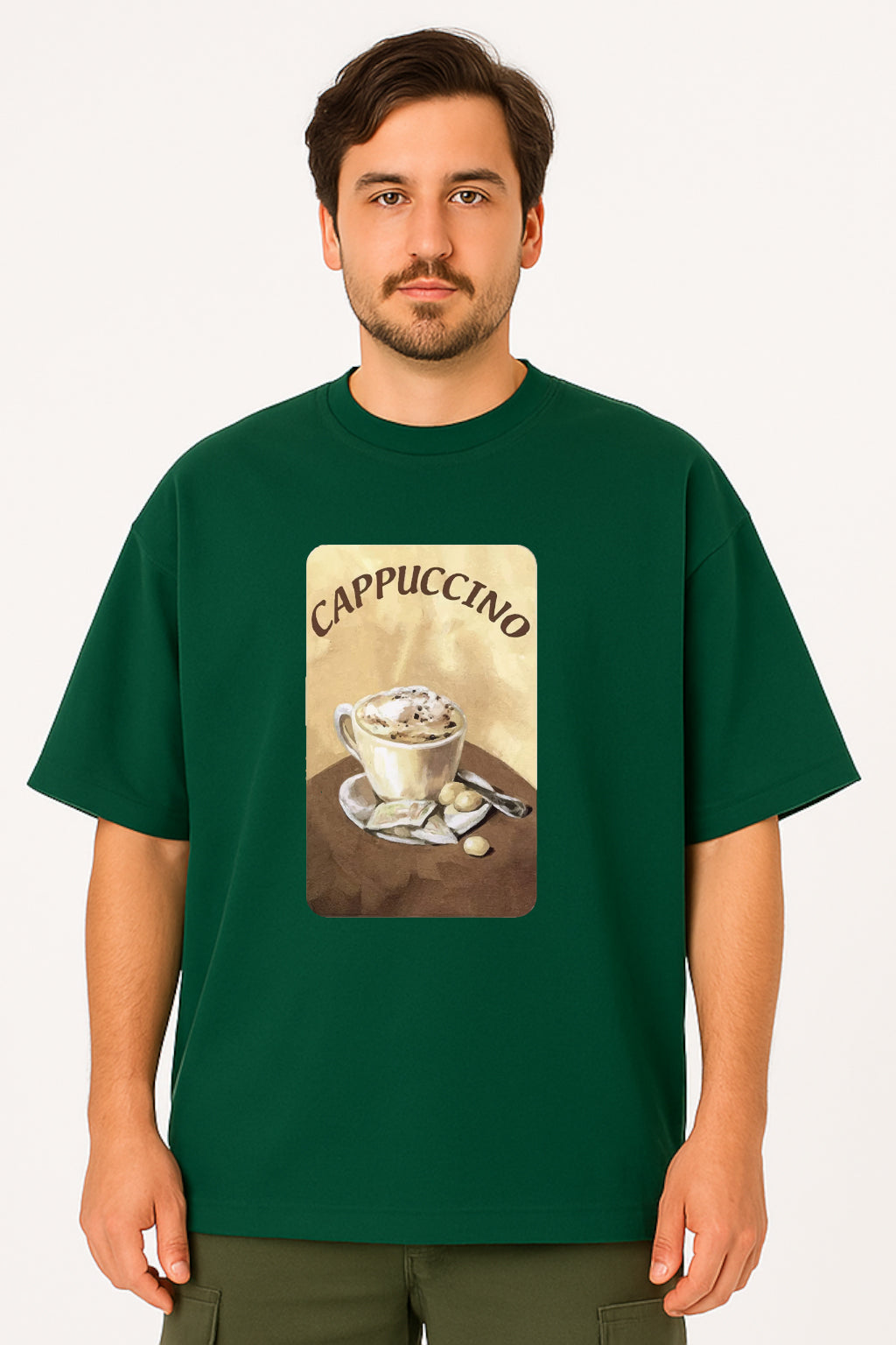 Man wearing a green t-shirt with a cappuccino graphic on a white background