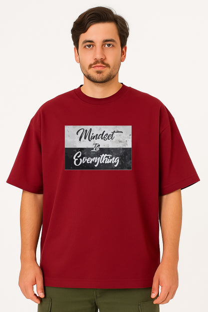 Man wearing a red t-shirt with 'Mindset is Everything' text design on a white background