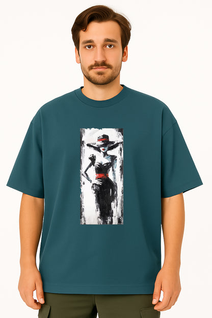 Man wearing a teal t-shirt with a graphic design of a woman in a hat and dress.